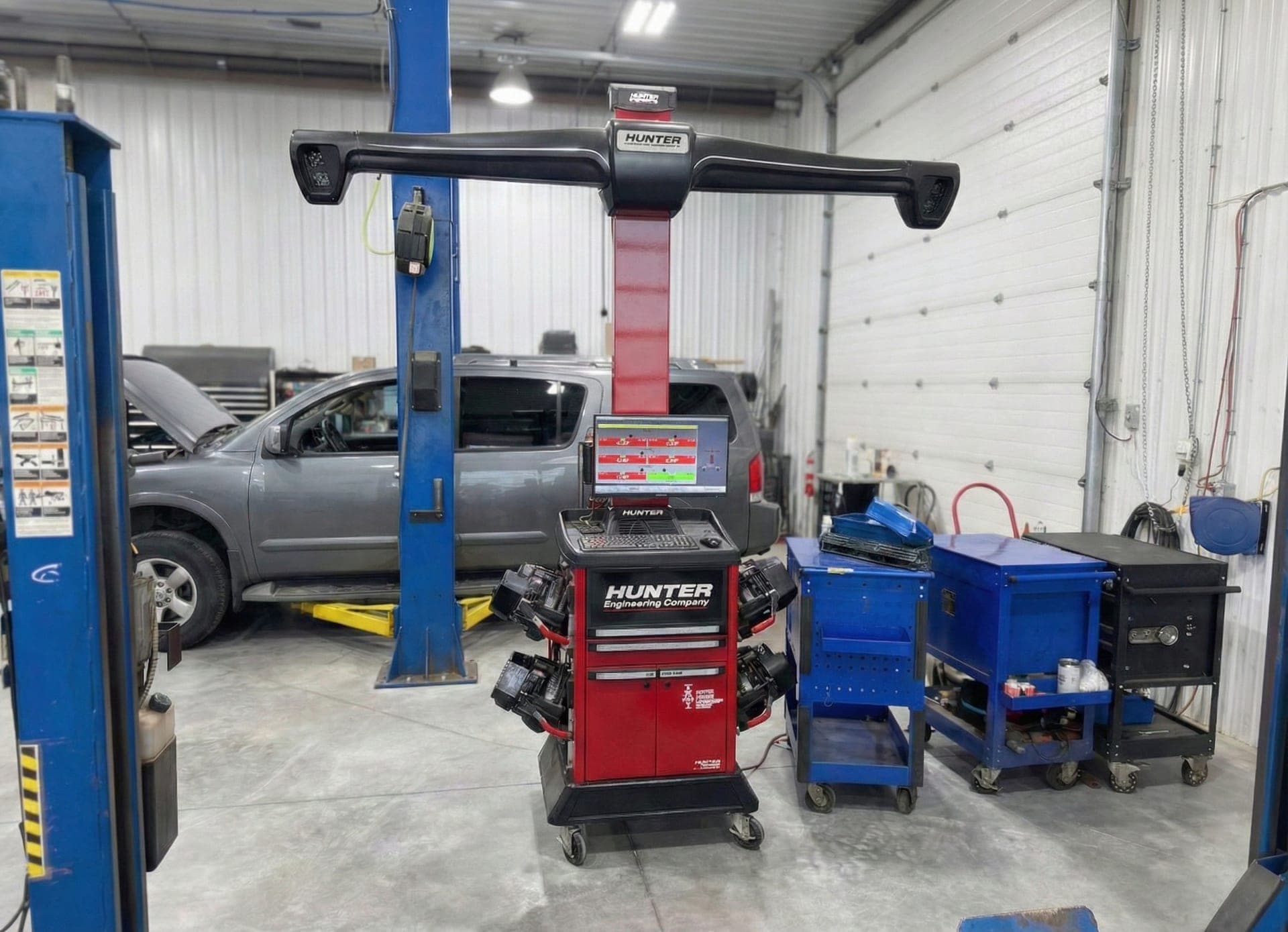 Hunter HawkEye Elite alignment system with truck on alignment rack